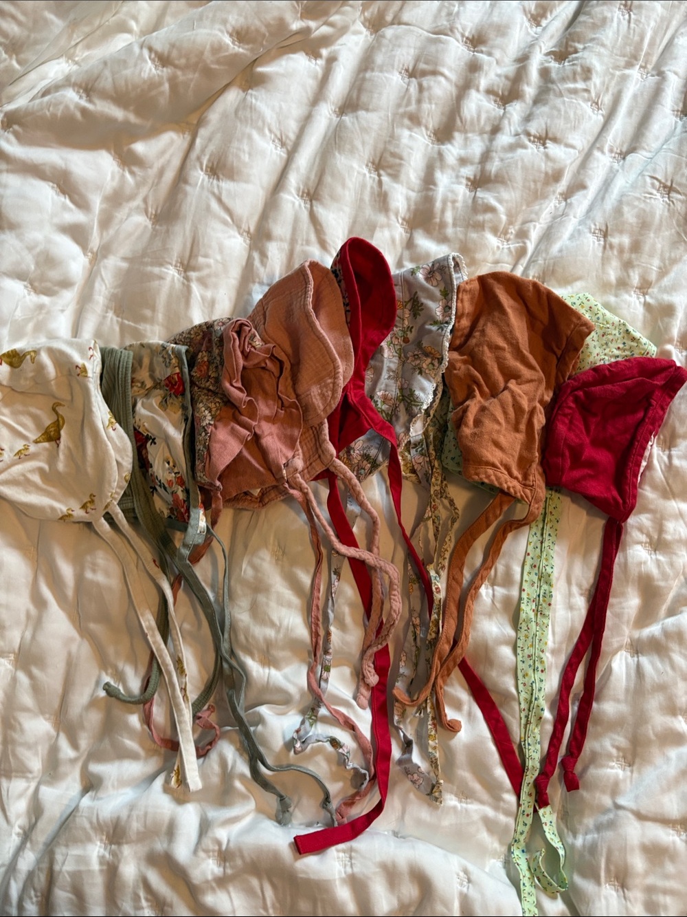 Girls' baby Bonnets Set in Pink, Rust, Red and Floral Prints - set of 11